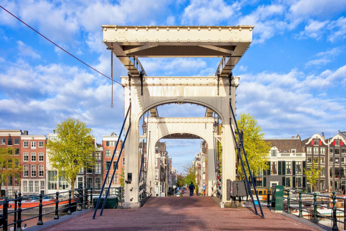One of the most famous bridges in Amsterdam is the Magere Brug, it was built in 1691 and was then called Kerkstraatbrug, Netherlands - © Artur Bogacki / Shutterstock