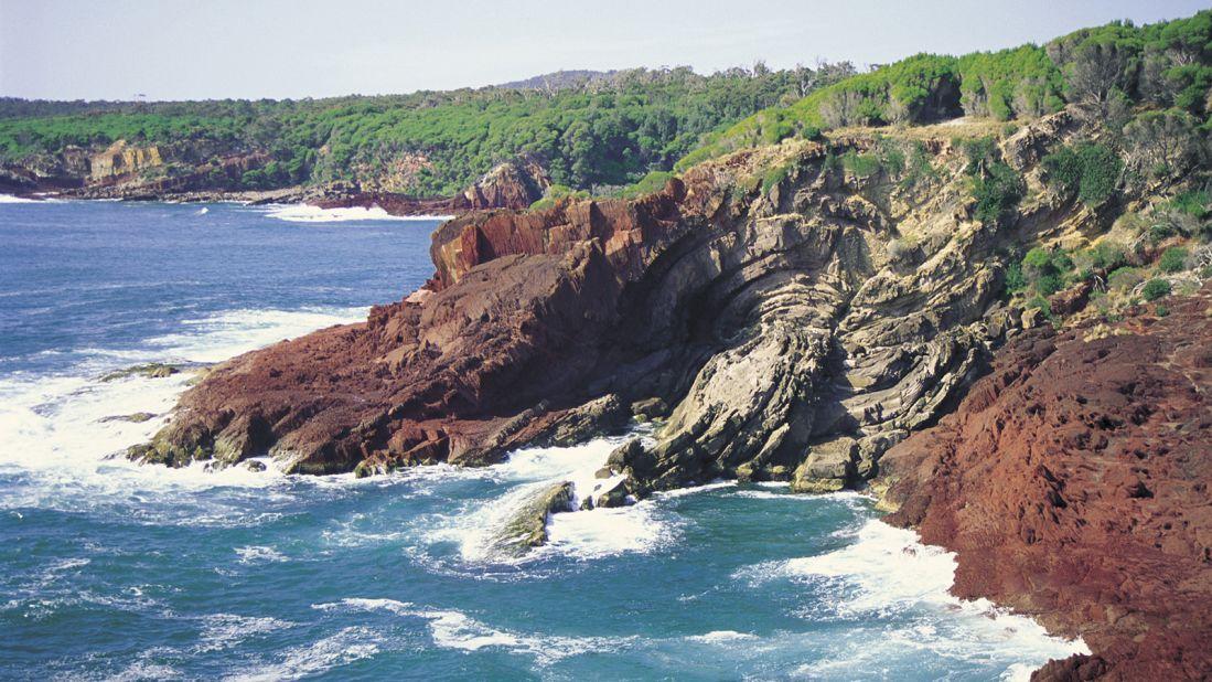 <strong>One of Australia's top coastal drives: </strong> Driving is arguably the most captivating way to travel between Melbourne and Sydney. This dramatic rock formation, near Boyd's Tower at Red Point on the Eden coastline, is just one of the scenic stops along the 878-kilometer route.